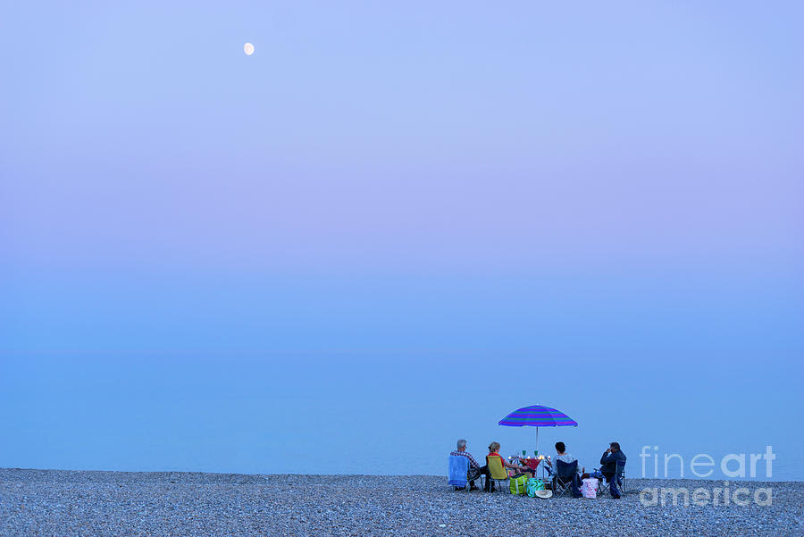 Beach Picnic by moonlight, Seaton, Devon, England, UK Photograph by Neale And Judith Clark