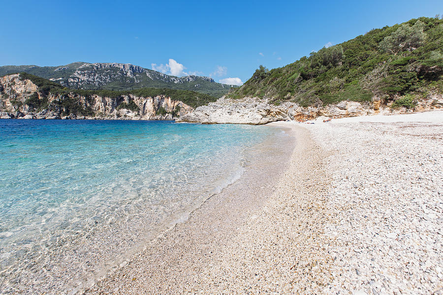 Secluded Rovinia beach in Liapades village, Corfu, Greece Photograph by Alexander Spatari