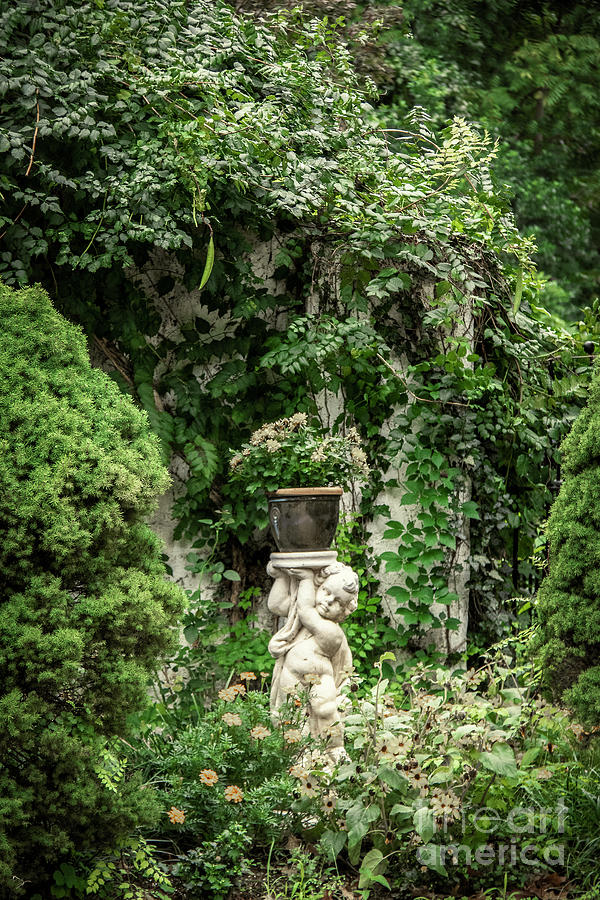 Secret Garden With Cupid Photograph by Susan Vineyard