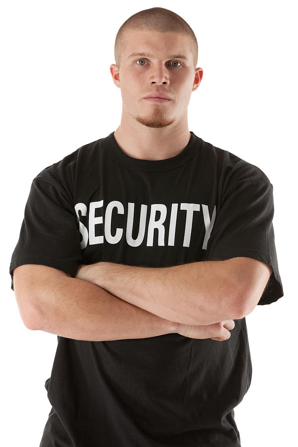 Security guard standing with his arms crossed Photograph by 4x6