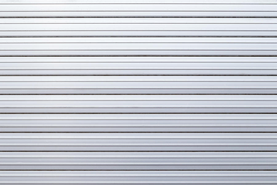 Security roller door background - corrugated metal sheet. Photograph by Tuomas A. Lehtinen