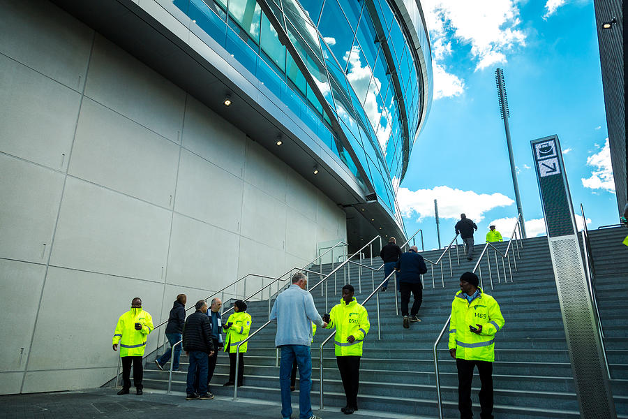Security staff outside new Tottenham Hotspur Stadium on match day, London, UK Photograph by Coldsnowstorm