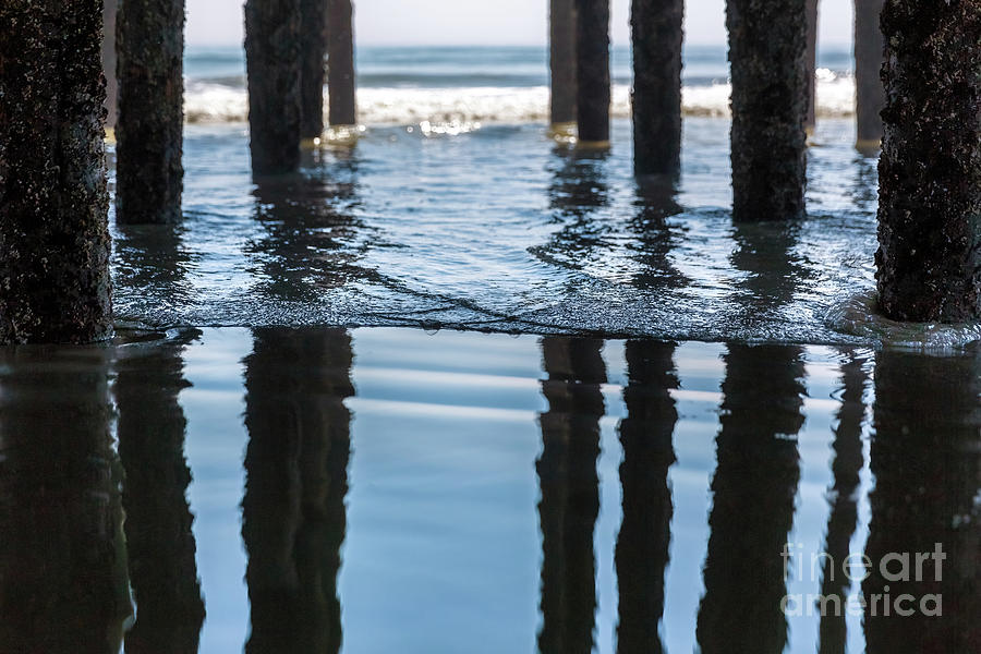 Selective focus on a gentle wave under the pier at Old Orchard B Photograph by Jane Rix
