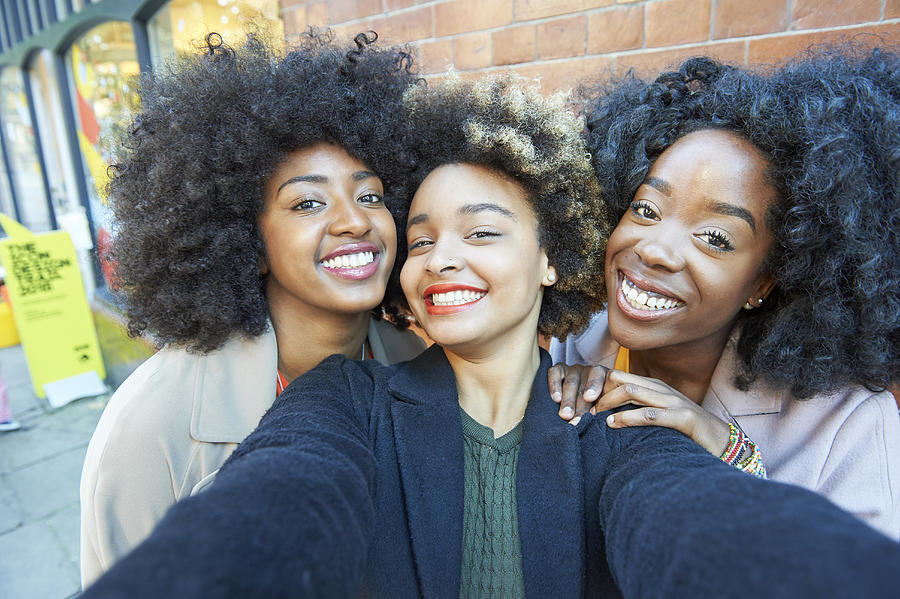 Selfie of three young friends. Photograph by Plume Creative