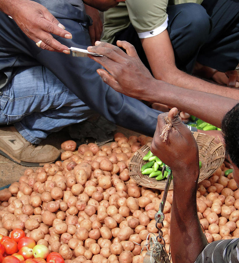 Selling potatoes at the  weekly market #BuyIntoArt   Photograph by Steve Estvanik