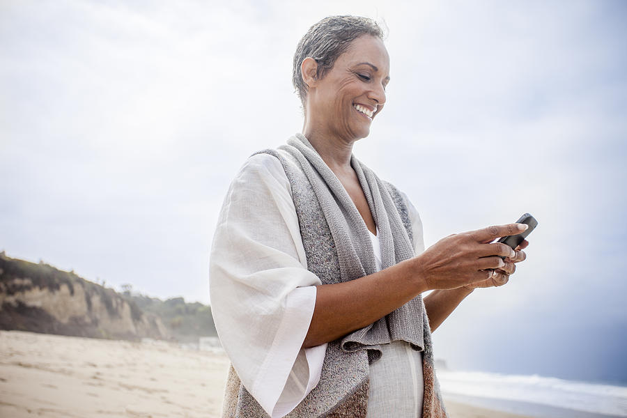 Senior African American Woman Checking Smartphone Photograph by Adamkaz