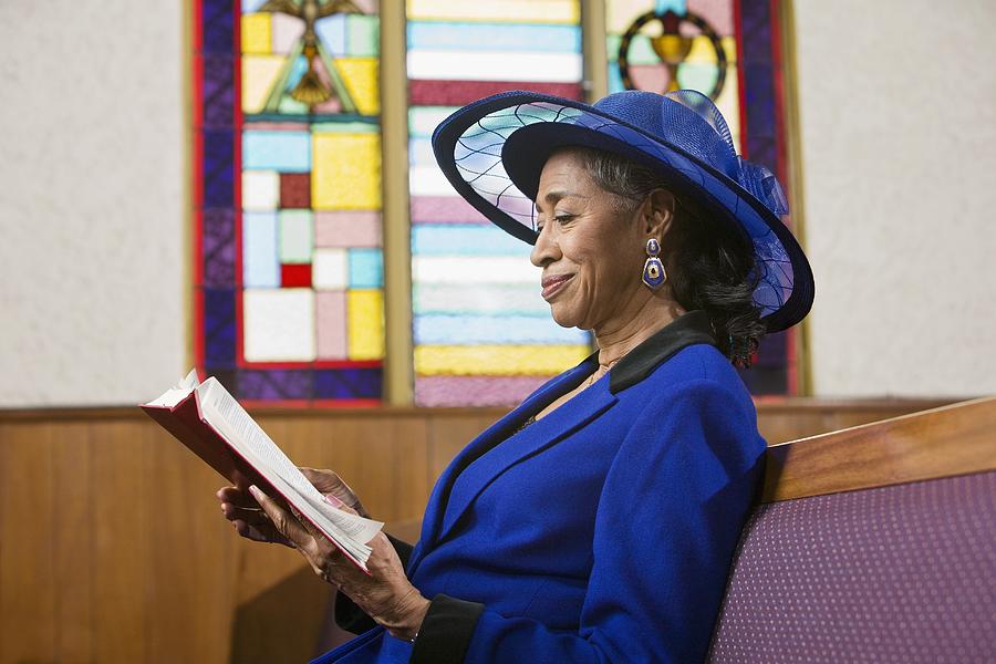 Senior African American woman in church Photograph by Hill Street Studios
