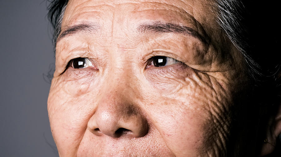 Senior asian woman eye Photograph by Xijian