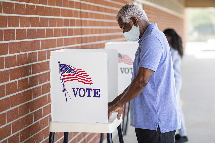 Senior Black Man Voting with a Mask Photograph by Adamkaz