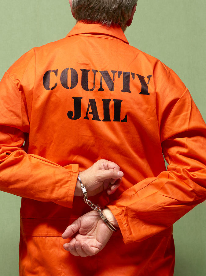 Senior county jail prisoner in hand cuffs Photograph by Peter Dazeley