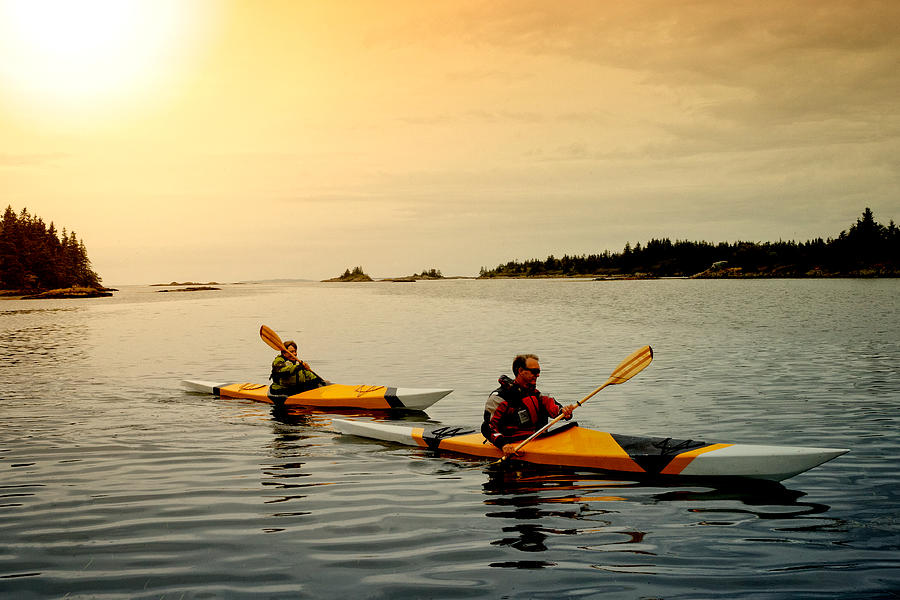 Senior Couple Kayaking Photograph by Stevecoleimages