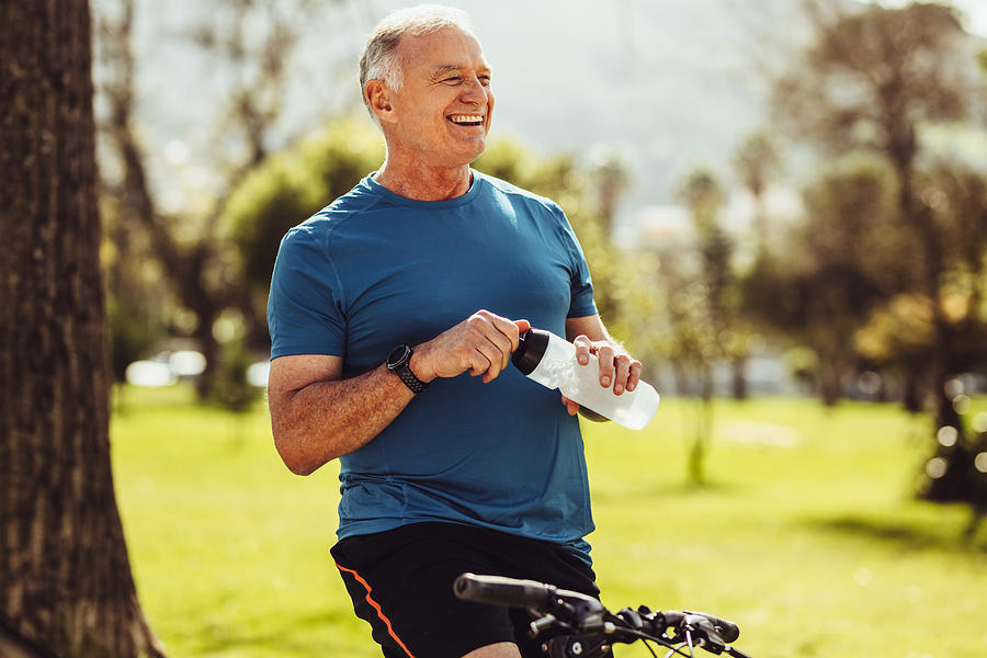 Senior fitness man drinking water Photograph by Jacoblund