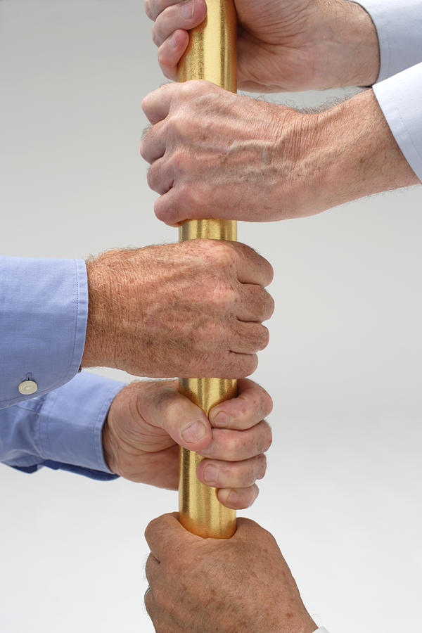 Senior male hands holding on to a golden bar Photograph by Darren Robb