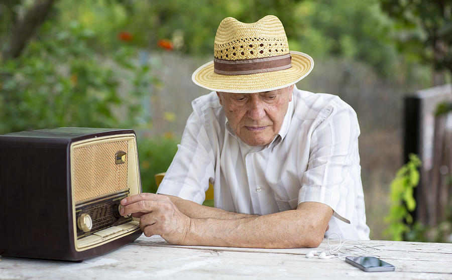 Senior man listening radio Photograph by Thanasis Zovoilis