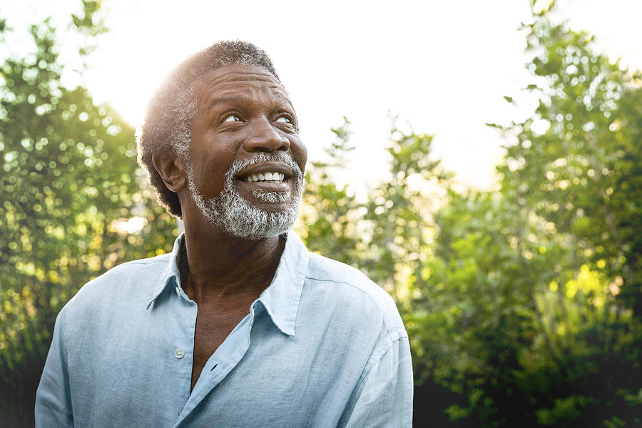 Senior man smiling outdoors Photograph by Jim Purdum