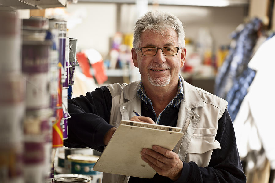 Senior Man Taking Inventory Photograph by Thomas_EyeDesign