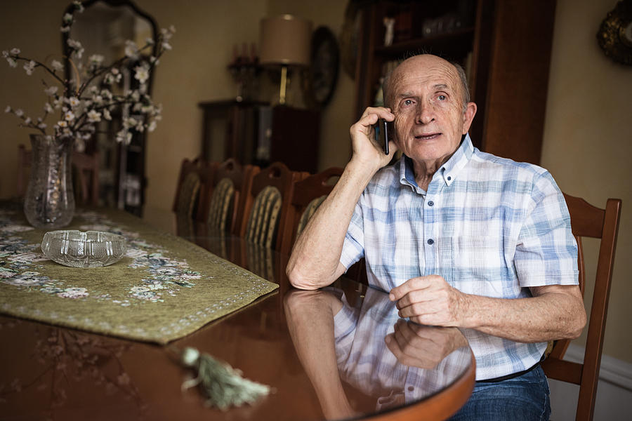 Senior man talking on phone Photograph by Dobrila Vignjevic