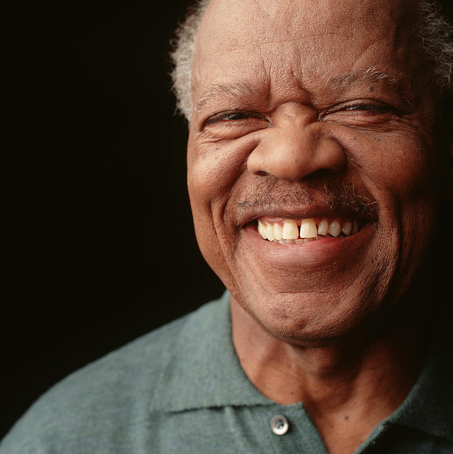 Senior man with moustache and toothy smile, posing in studio, close-up, portrait Photograph by Ryan McVay