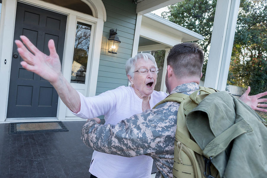 Senior mom runs to greet military son Photograph by SDI Productions
