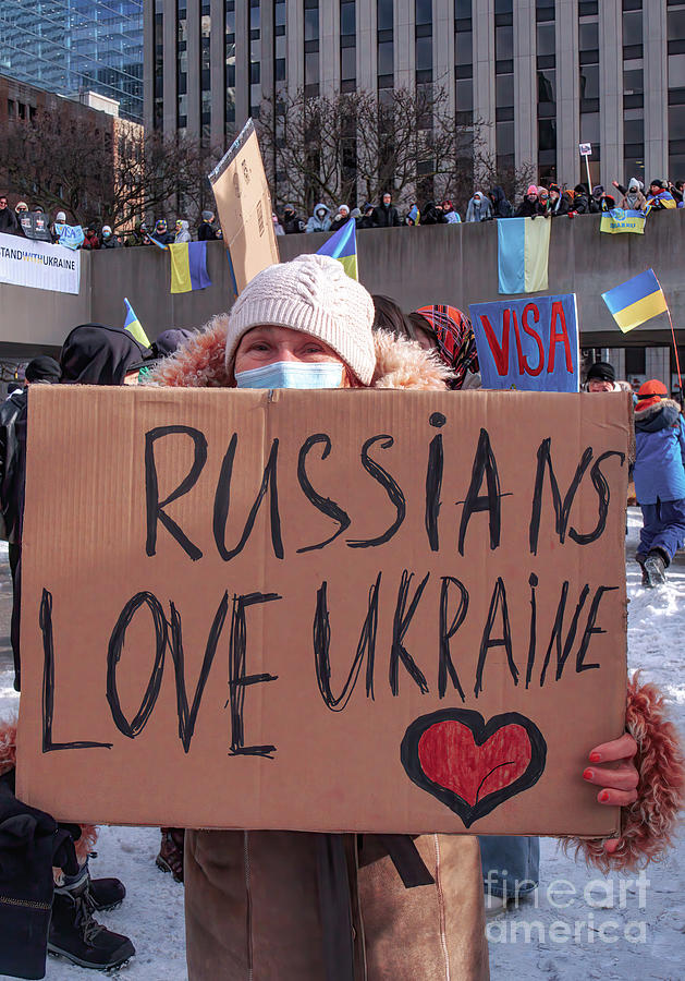 Senior with Russians Love Ukraine Placard Photograph by Charline Xia