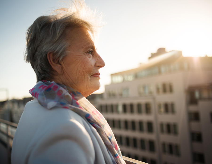 Senior Woman On Roofgarden Photograph by Hinterhaus Productions
