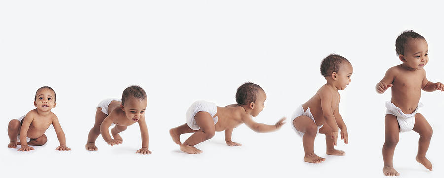 Sequence Showing a Baby in a Nappy Learning to Walk Photograph by Digital Vision.