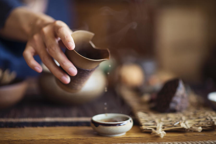 Serving Chinese tea into ceramic tea cups Photograph by Leren Lu