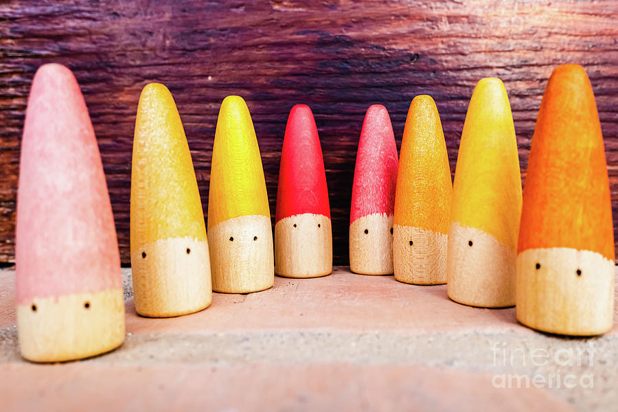 Set of colored wooden conical fish toys for unstructured childrens games. Photograph by Joaquin Corbalan