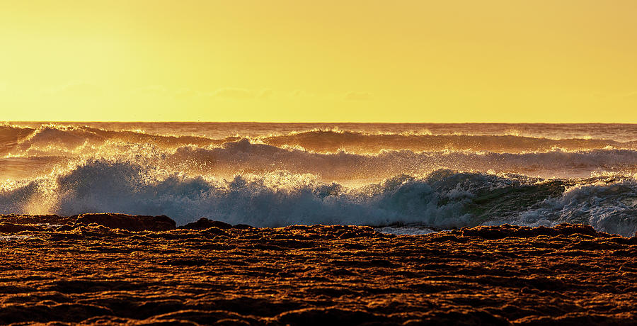 Setting sun lights crashing waves Photograph by Steven Heap