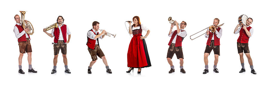 Seven costumed members of a Bavarian/Austrian brass band Photograph by DaveLongMedia