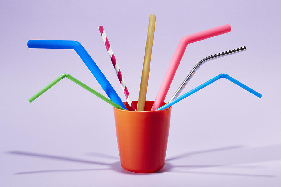 Seven different drinking straws in a cup Photograph by Richard Drury