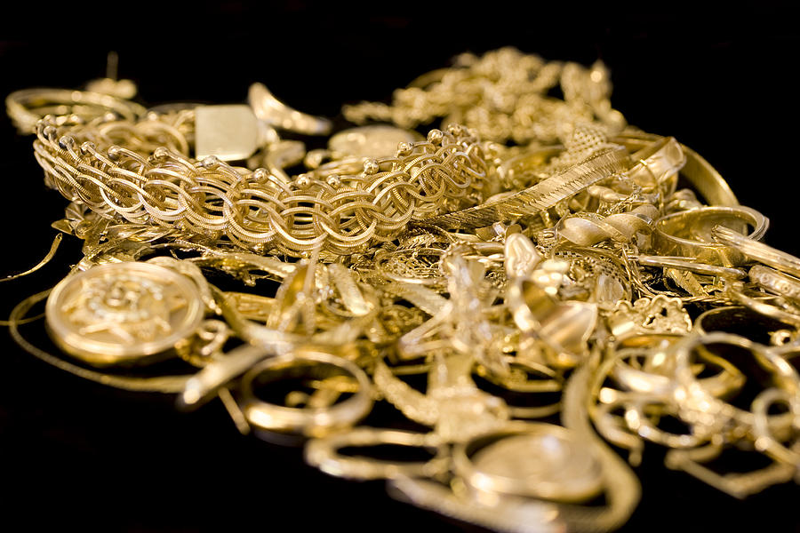 Several pieces of gold jewelry in a pile Photograph by Lissart