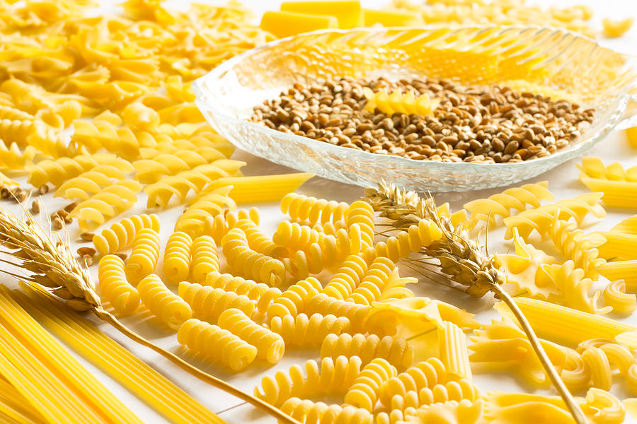Several types of pasta, spikelets of wheat, wheat grain Photograph by Olenaa