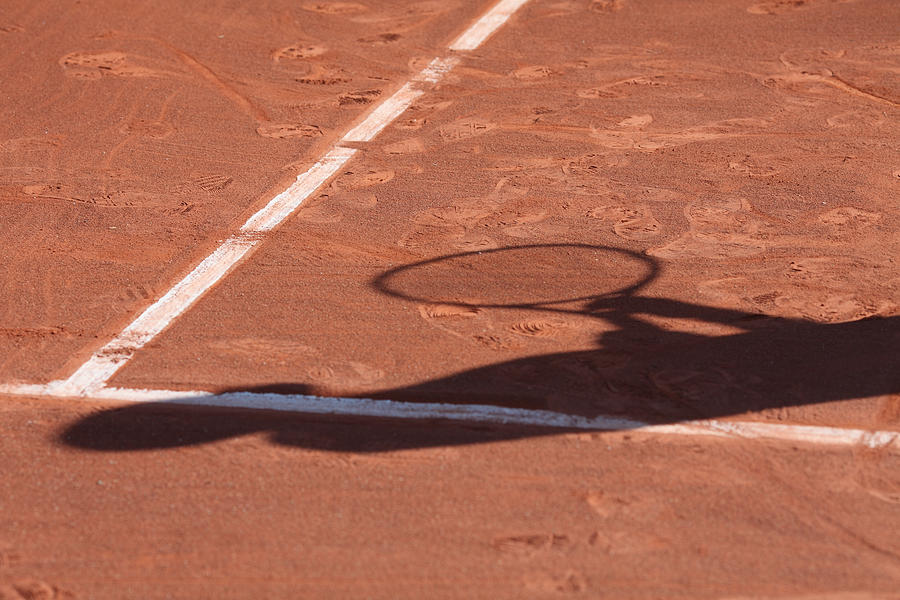 Shadow Of A Tennis Man Photograph by Martial Colomb