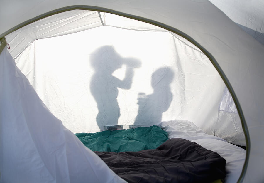 Shadow of two people outside a tent in the sunshin Photograph by Ashley Jouhar