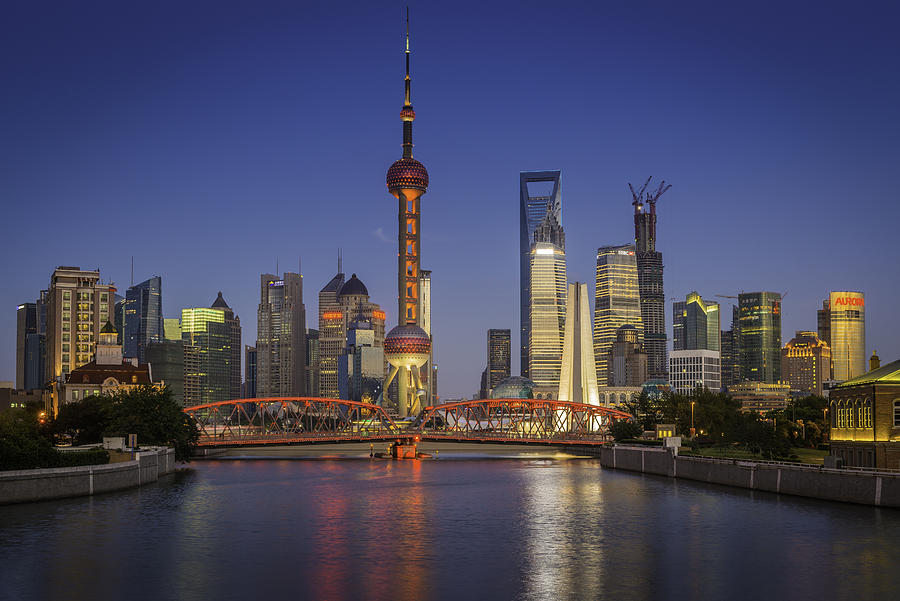 Shanghai Oriental Pearl Tower Waibaidu bridge Pudong skyscrapers illuminated China Photograph by fotoVoyager