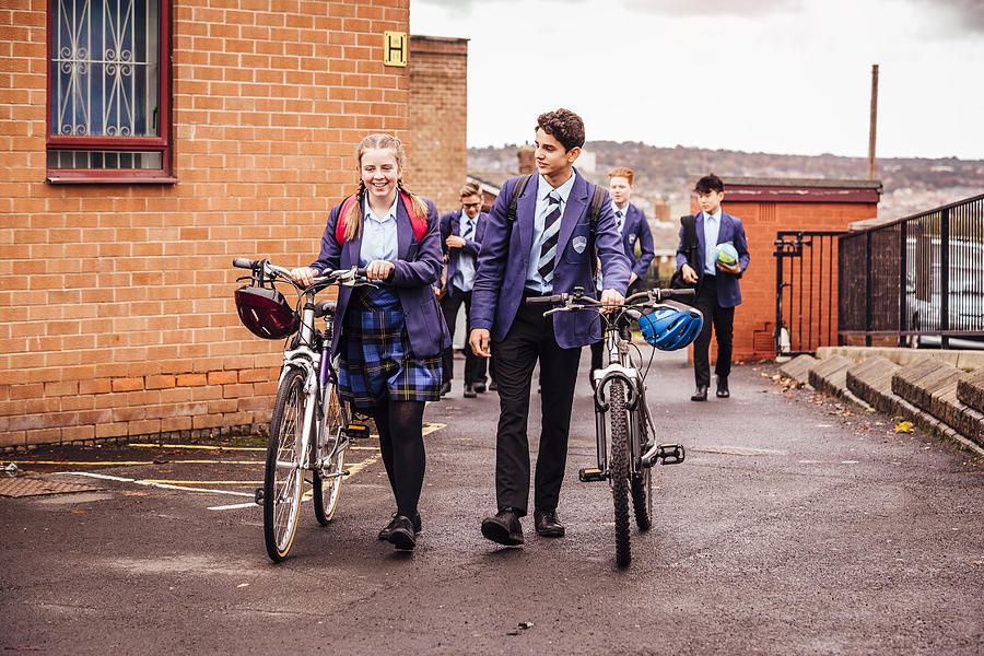 She Cycles to School and Back Photograph by SolStock