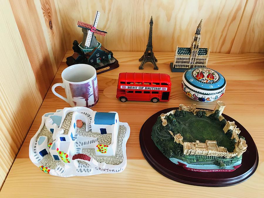 Shelf with Travel Souvenirs Photograph by Jan Dolezal