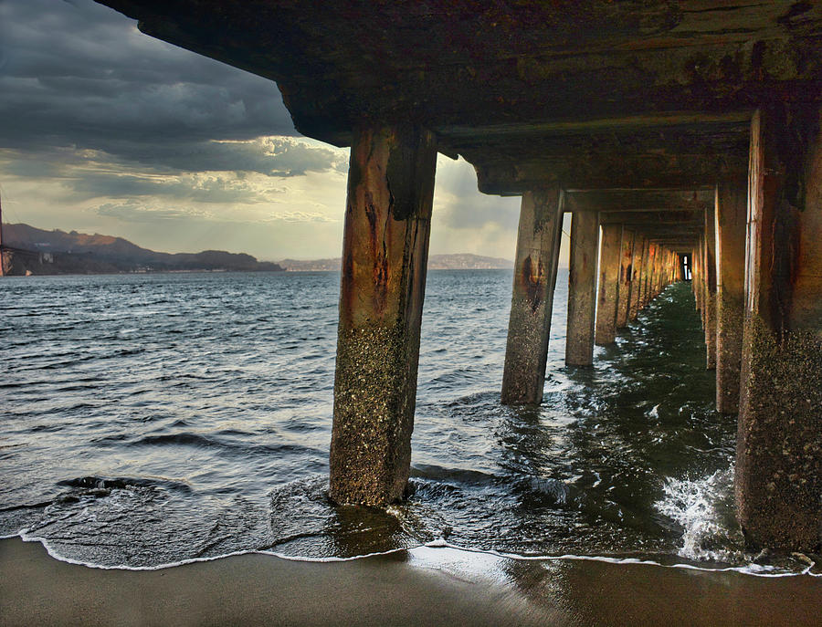 Shelter From the Storm under Torpedo Wharf in San Francisco Bay Photograph by Maggy Marsh