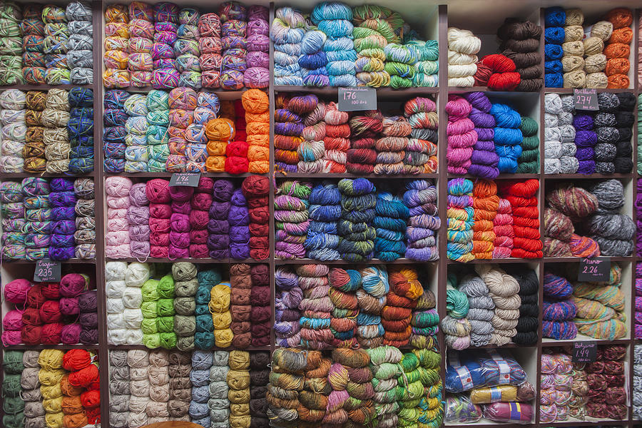 Shelves full of yarn at store Photograph by REB Images