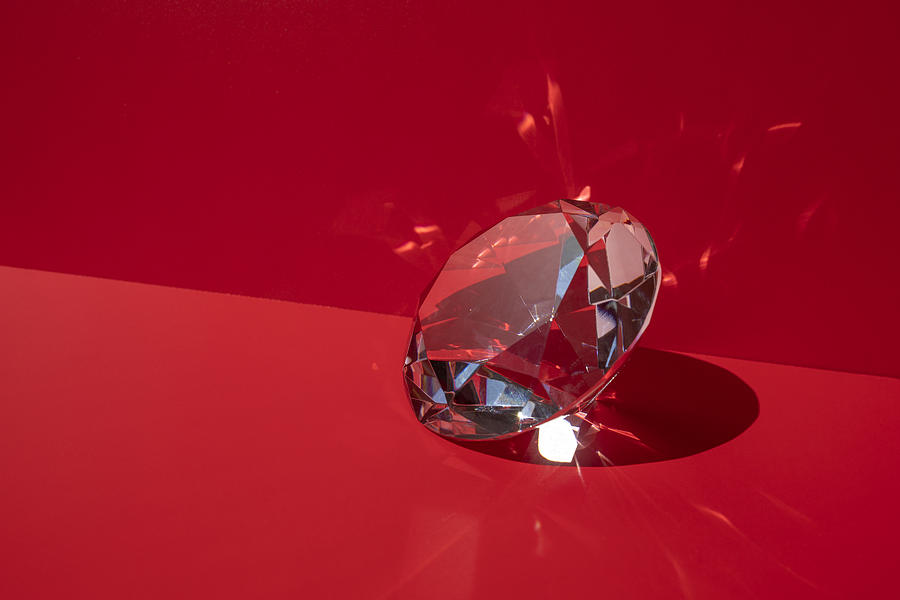 Shiny diamond on the red background Photograph by Yulia Reznikov