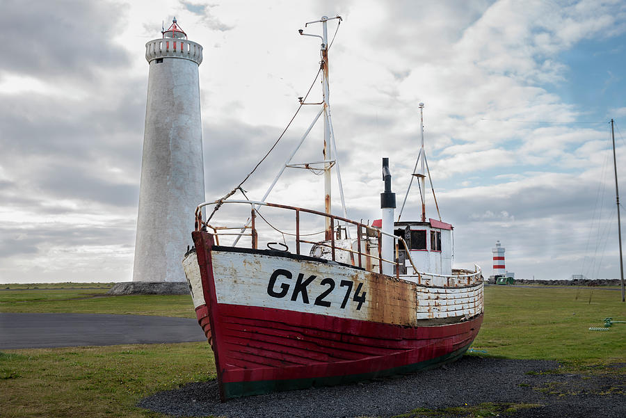 Shipwreck and Gardur lighthouses on Reykjanes Peninsula Photograph by RicardMN Photography
