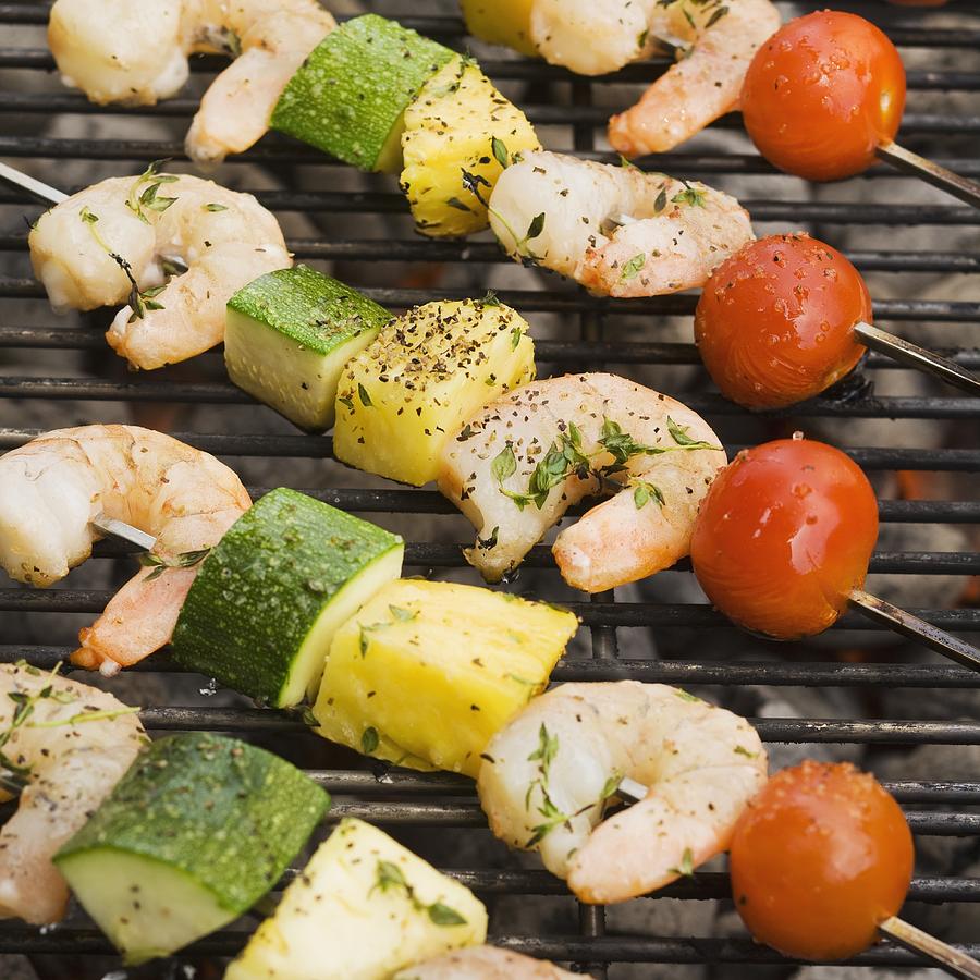 Shish kebab cooking on grill Photograph by Tetra Images