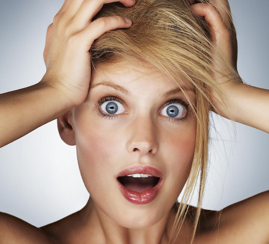 Shocked blond woman Photograph by Momentimages