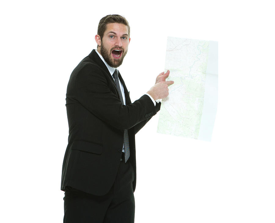 Shocked businessman pointing at map Photograph by 4x6