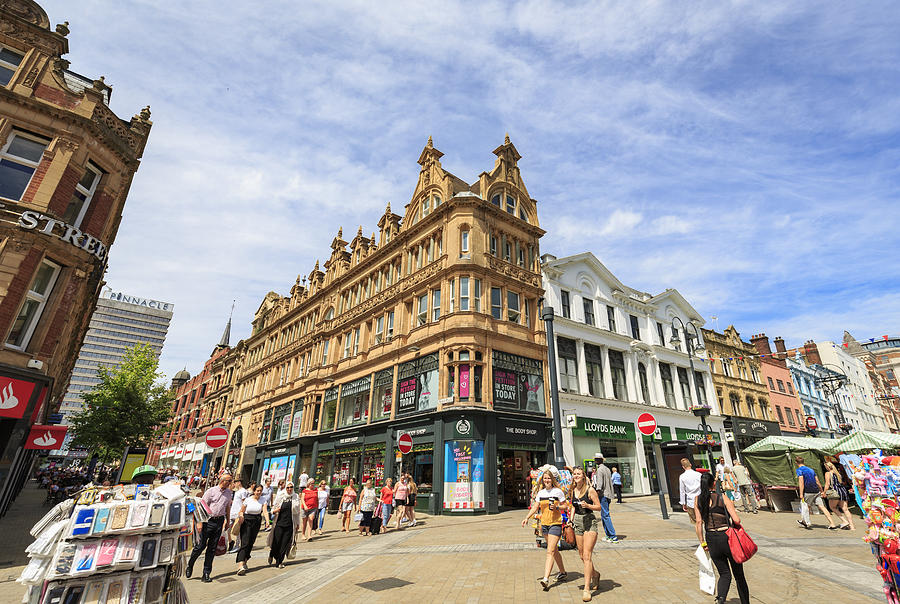 Shoppers walking in a pedestrianised area of Leeds Photograph by Kelvinjay