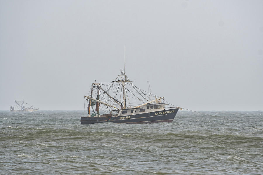 Shrimp Trawlers Work Off The Coast Of North Carolina Photograph