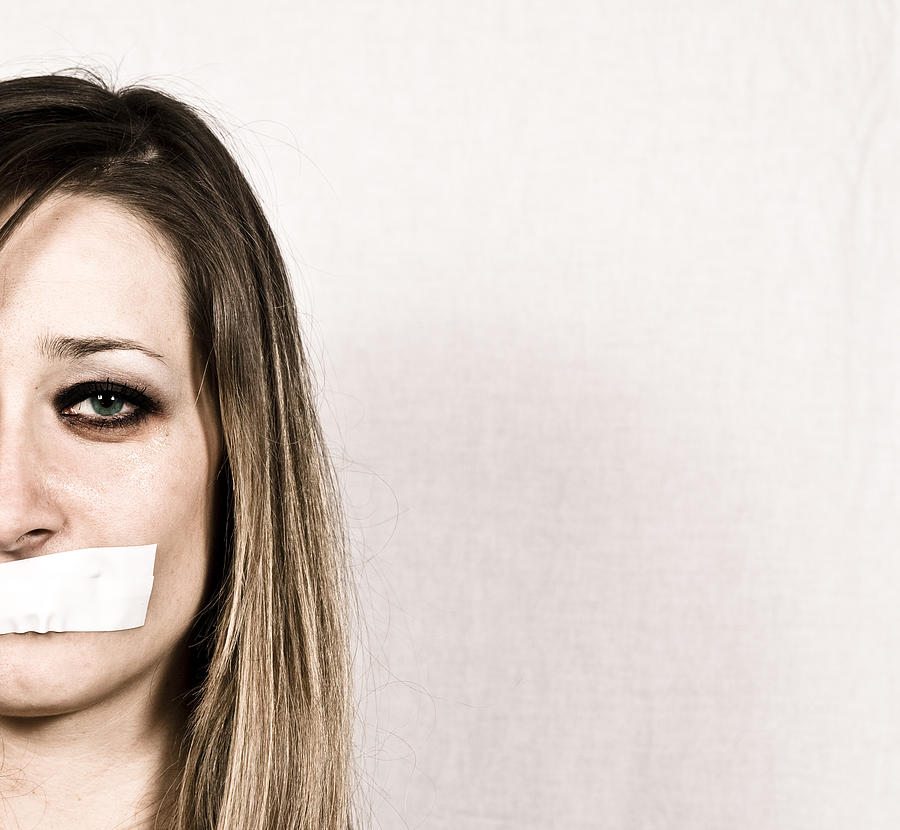 Shut up concept of woman with tapes mouth Photograph by Piccerella