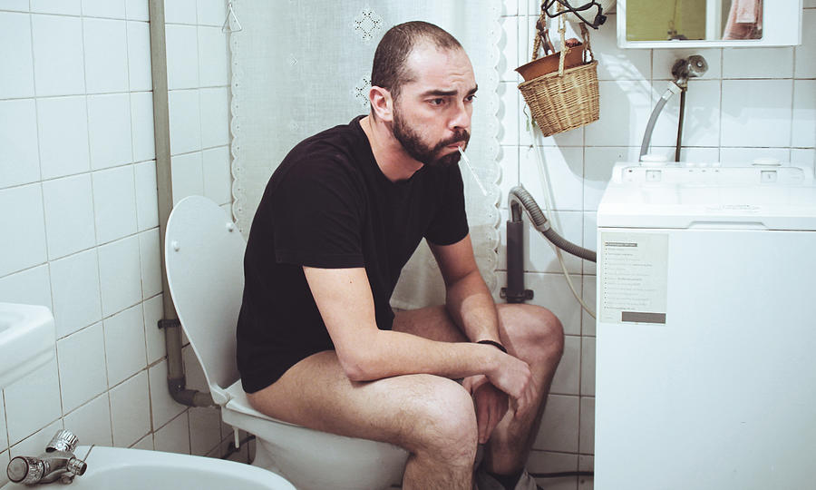 Sick man in the toilet Photograph by Saulgranda