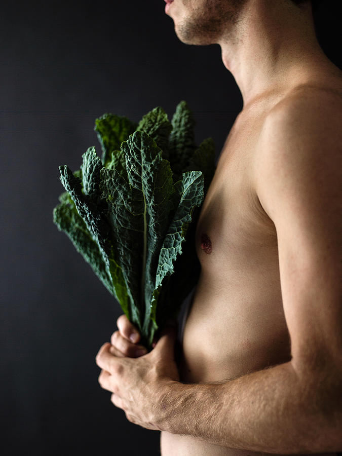 Side angel man holding kale Photograph by Ray Kachatorian